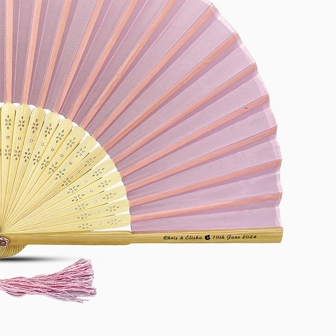 A Soft Pink solid color hand fan, featuring a personal message printed on main rib.