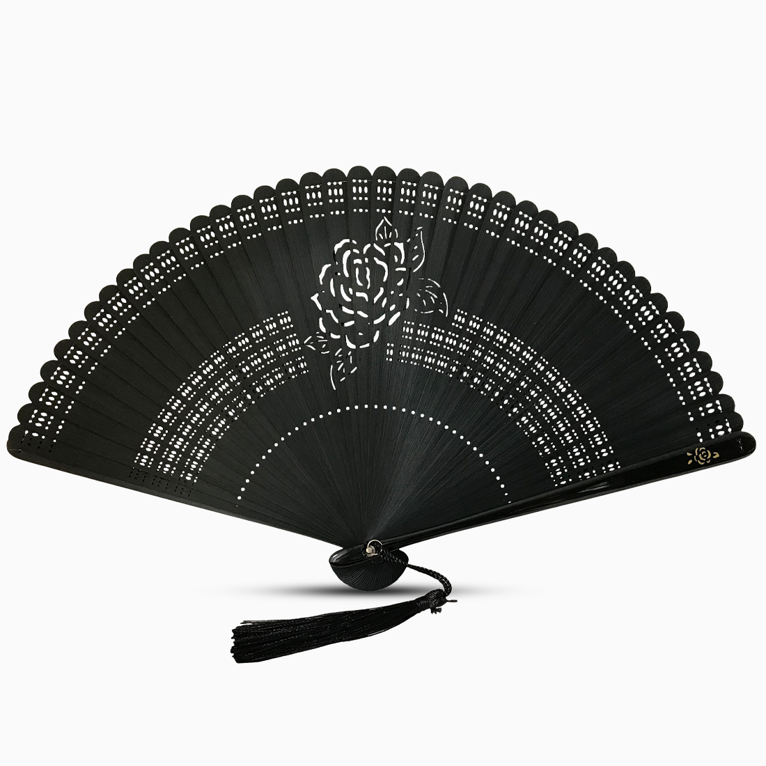 A black wooden hand fan with a rose flower cut design and a decorative tassel attached.