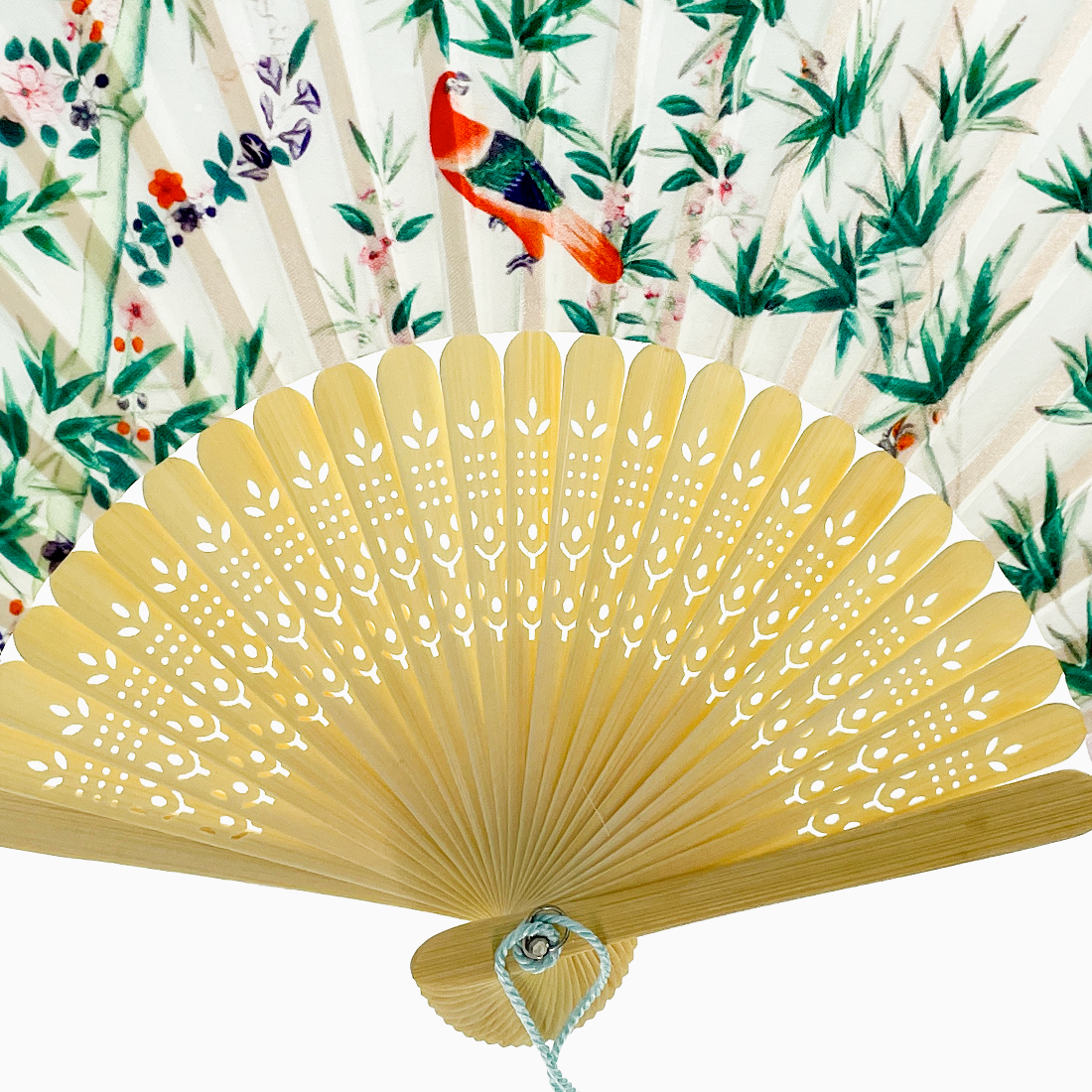 fabric fan featuring a bird pattern and carved bamboo rib design.
