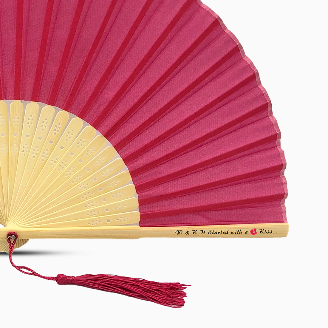 A Deep Pink solid color hand fan, featuring a personal message printed on main rib.