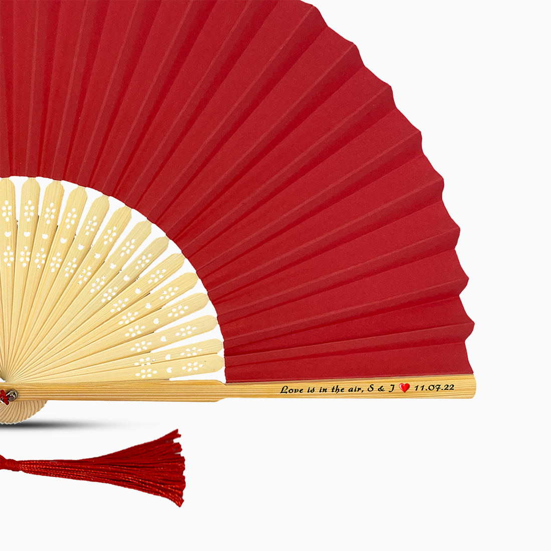 A Red solid color hand fan, featuring a personal message printed on main rib.