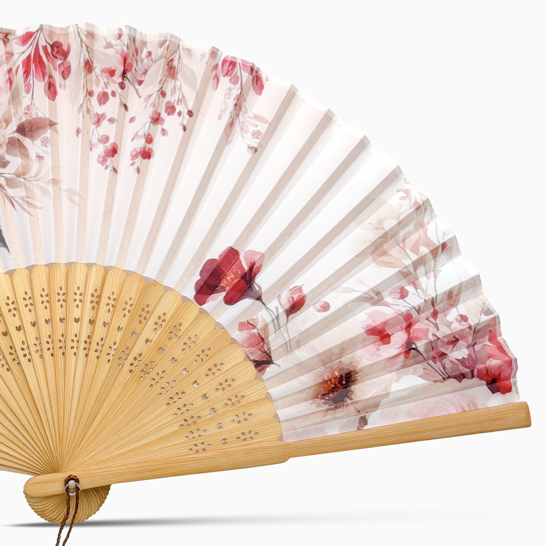 A silk hand fan featuring a floral design with wooden rib.