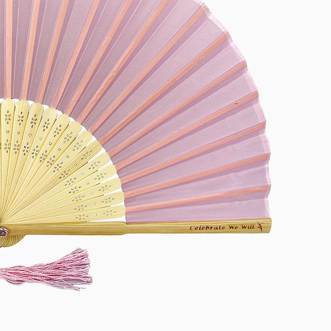 A folding fan with baby pink and beige hues features a stylish tassel. Its engraved text on the wooden rib, radiating elegance and charm.