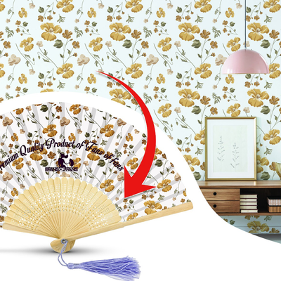 Hand fan featuring a floral pattern, displayed in a room setting, showcasing its design and the surrounding decor.