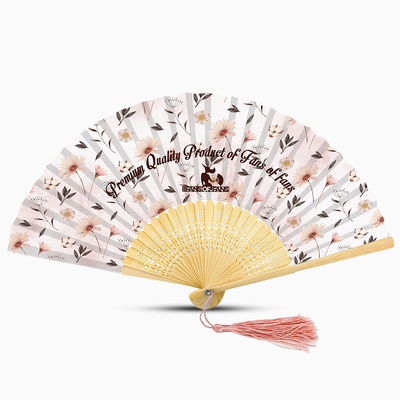 A white hand fan featuring a floral design and a pink tassel, elegantly displayed against a neutral background.