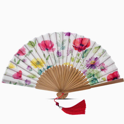 Elegant silk folding hand fan with natural bamboo ribs, featuring a colourful floral design of red poppies, yellow daisies, and purple blossoms, finished with a red tassel.