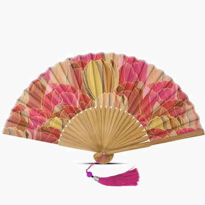Decorative hand fan with floral design and pink tassel on a white background