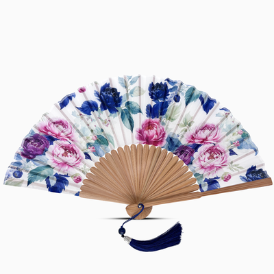 Floral-patterned hand fan on a white background