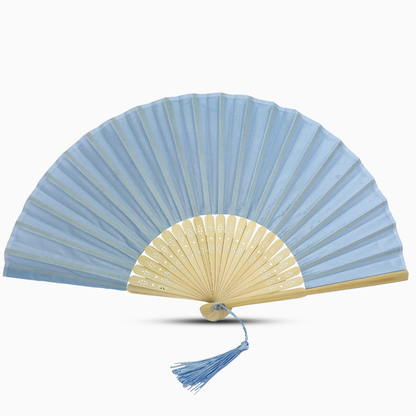 A baby blue fabric fan with a tassel, showcasing a solid color design.