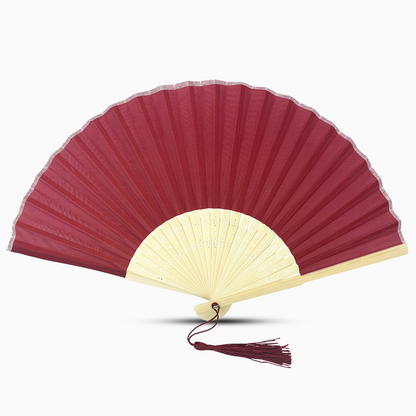 A Maroon Red fabric fan with a tassel, showcasing a solid color design.