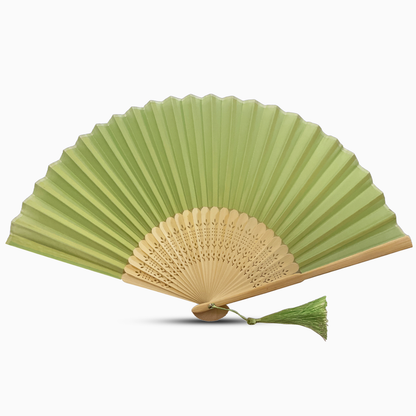 A sage green fabric fan with a tassel, showcasing a solid color design.