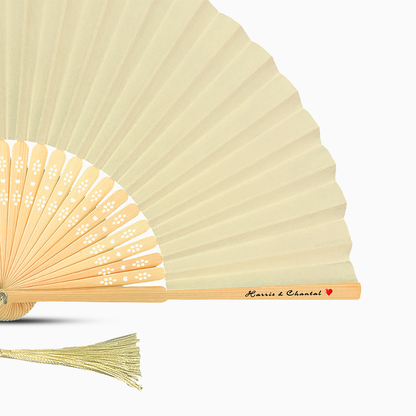 A Ivory Beige solid color hand fan, featuring a personal message printed  on main rib.