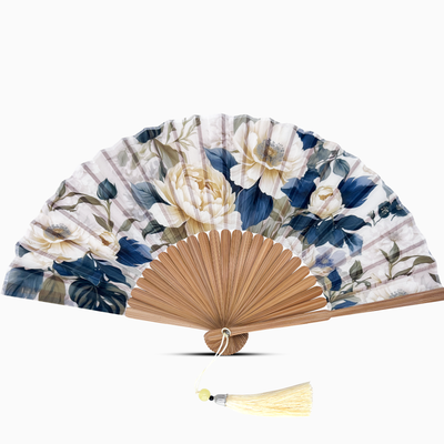 Floral-patterned hand fan with wooden frame and tassel on a white background