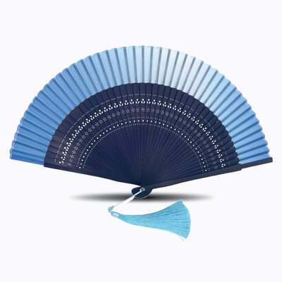 Baby blue silk border folding hand fan with dark blue hollow-carved bamboo ribs and matching blue tassel, displayed open on a white background