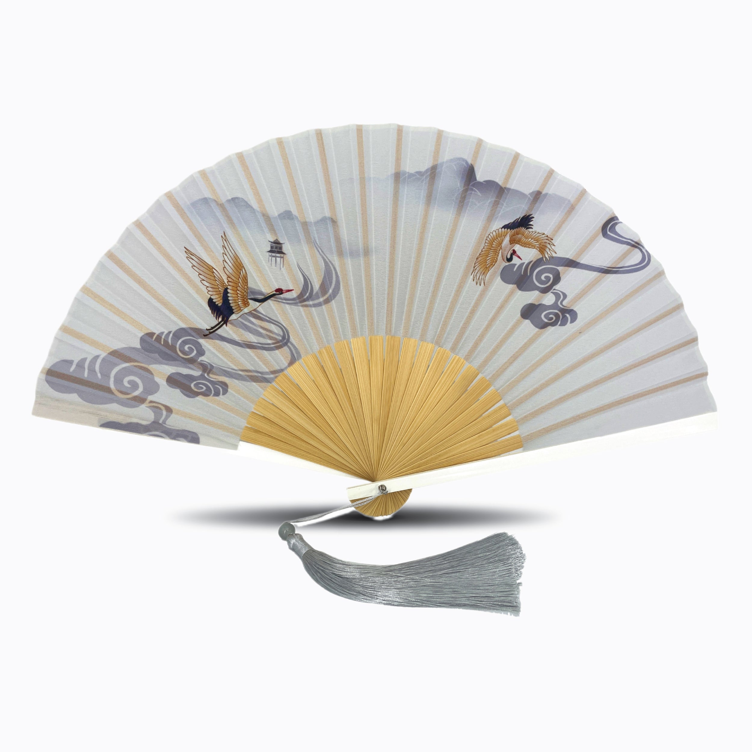 Light grey silk folding hand fan featuring flying crane artwork over misty mountains and swirling clouds, with natural bamboo ribs and a silver tassel
