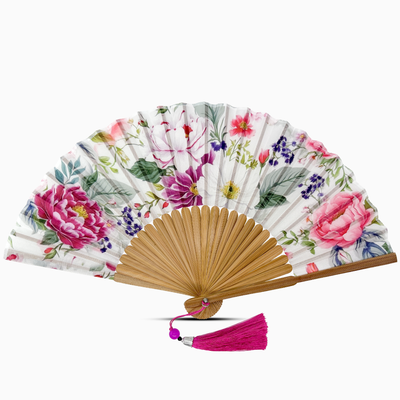Floral-patterned hand fan with wooden frame and pink tassel on a white background