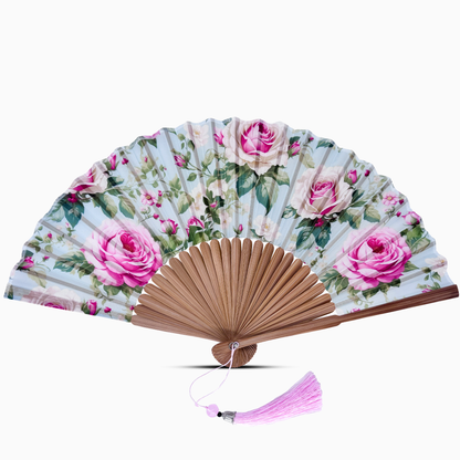 Floral-patterned hand fan with pink roses on a white background
