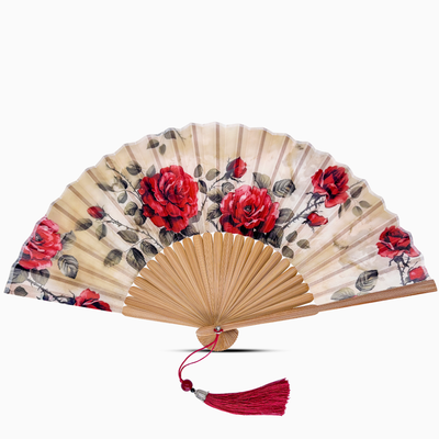 Handheld fan with red floral design on a white background