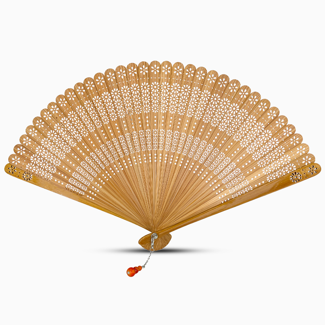 A natural wooden hand fan with a round cut design and a decorative tassel attached.