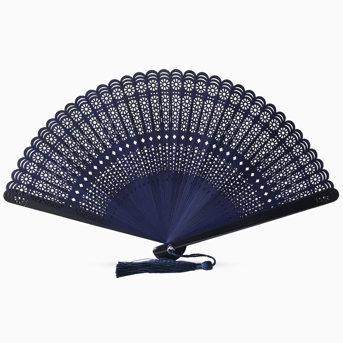 A navy blue wooden hand fan with a round cut design and a decorative tassel attached.
