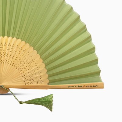 A Sage Green solid color hand fan, featuring a personal message printed  on main rib.