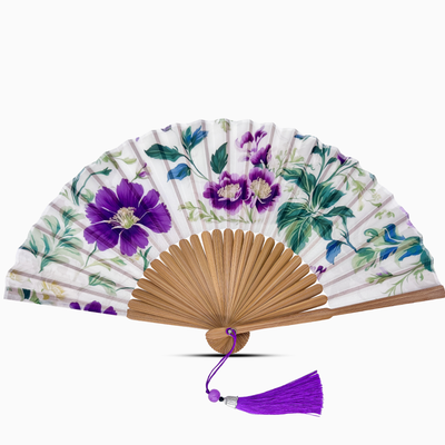Floral-patterned hand fan with purple flowers on a white background