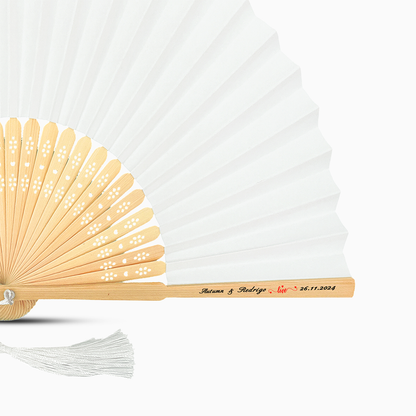 A White solid color hand fan, featuring a personal message printed  on main rib.